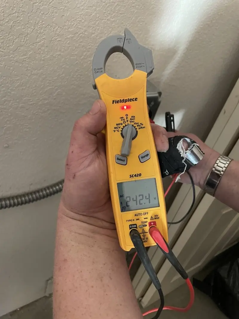 Voltage testing with clamp meter during Ceiling Fan Installation in Berryville